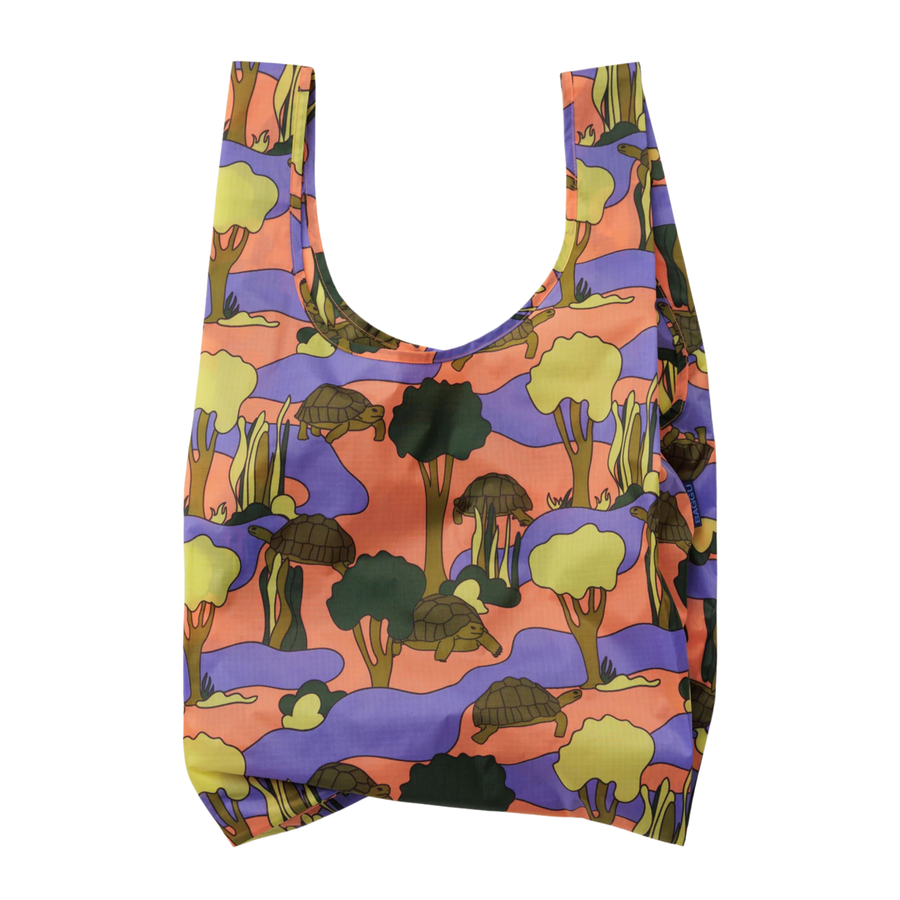 Reusable baggu bag with a colorful turtle pattern on a white background