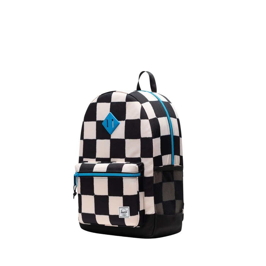black and white checkerboard herschel youth backpack with blue accents on a white background