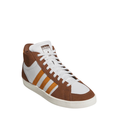 Brown and white Adidas superskate skateboard sneaker with orange accents on a white background