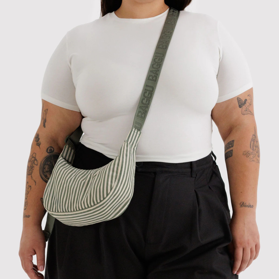 green and white Striped  baggu handbag with a strap on a white background
