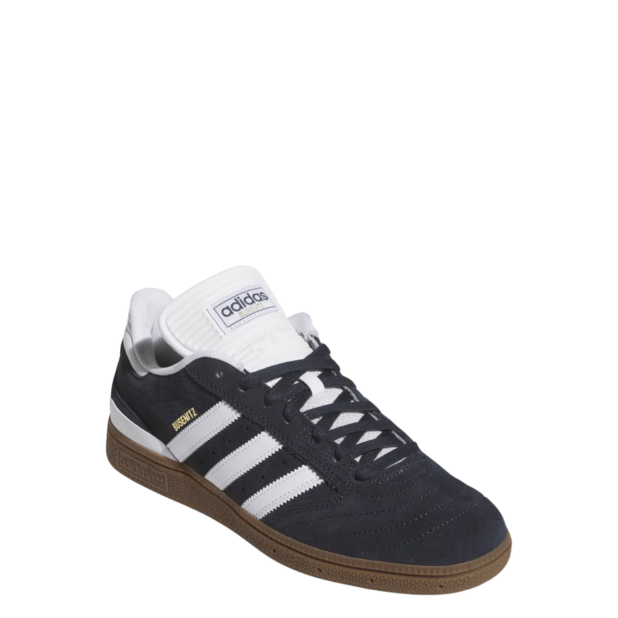dark grey adidas busenitz skateboarding shoe with white strips and tongue and  gum sole on a white background