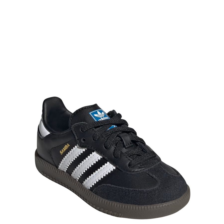 A single Adidas Samba kids sneaker in black leather with signature white side stripes, a gold 'SAMBA' text on the side, and a dark brown gum sole, shown against a plain white background.