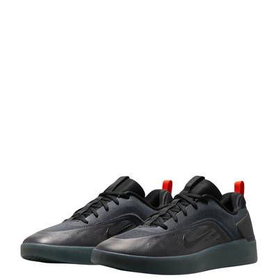 a pair of black Nike nyjah 4 skateboard sneaker with a textured synthetic upper, black laces, a black sole, and a small red pull tab on the heel, shown from a side profile against a white background.