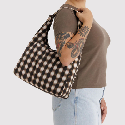 blurred gingham baggu nylon shoulder bag on a a person