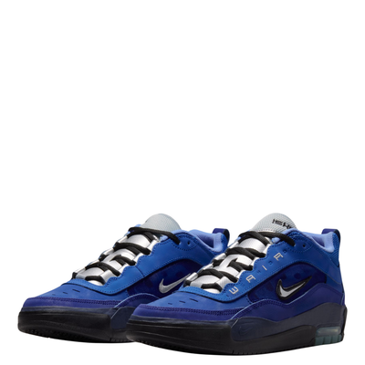 A Nike sb ishod wair Air Max sneaker in a vibrant royal blue colorway, featuring a black Swoosh logo, black laces, and a black midsole, shown from a side profile on a white background.