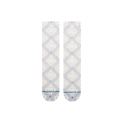A pair of Stance alhambra butterblend crew socks with a light gray and white pixelated geometric pattern, featuring a small blue logo and 'STANCE' branding on the toes.