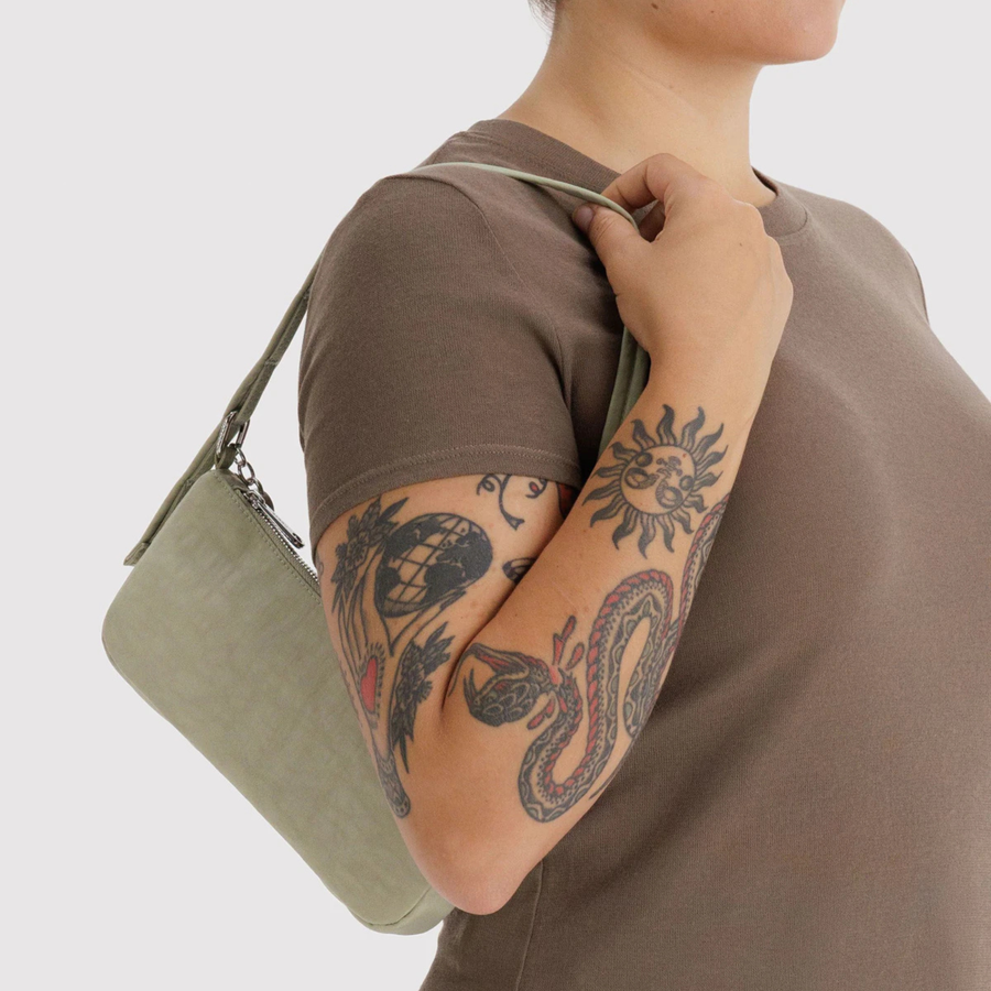 light green baggu handbag with a strap on a white background