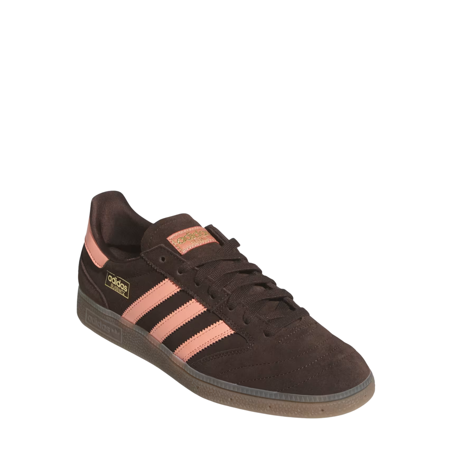 Brown Adidas busentiz adv skate sneaker with pink accents on a white background
