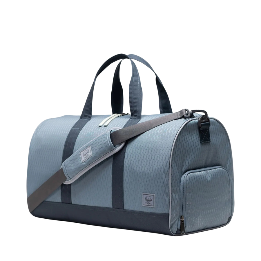 blue diamond patterened herschel novel duffle bag