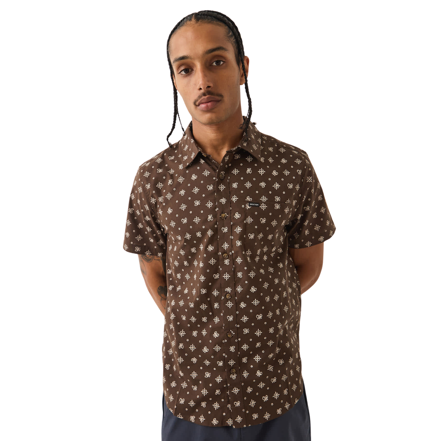brown brixton men's charter print short sleeve woven button-up shirt with a bandana pattern on a man on a white background