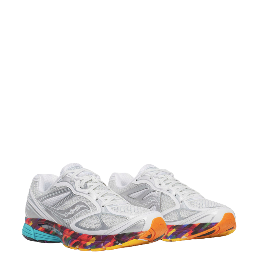 White saucony boston progrid guide 7 running shoe with colorful sole on a white background