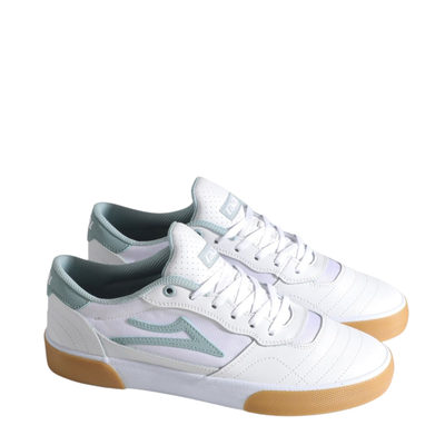White lakai cambridge elite sneaker with light blue accents and brown sole on a white background