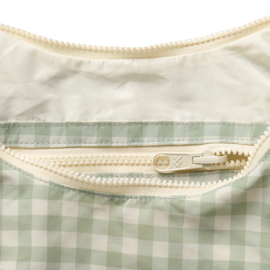 green and off white thread slouchy shoulder bag on a white background