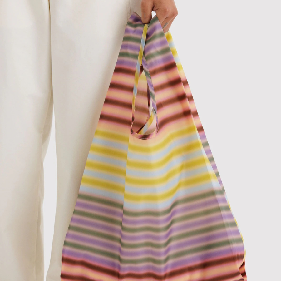 Multicolored striped baggu reusable bag on a white background