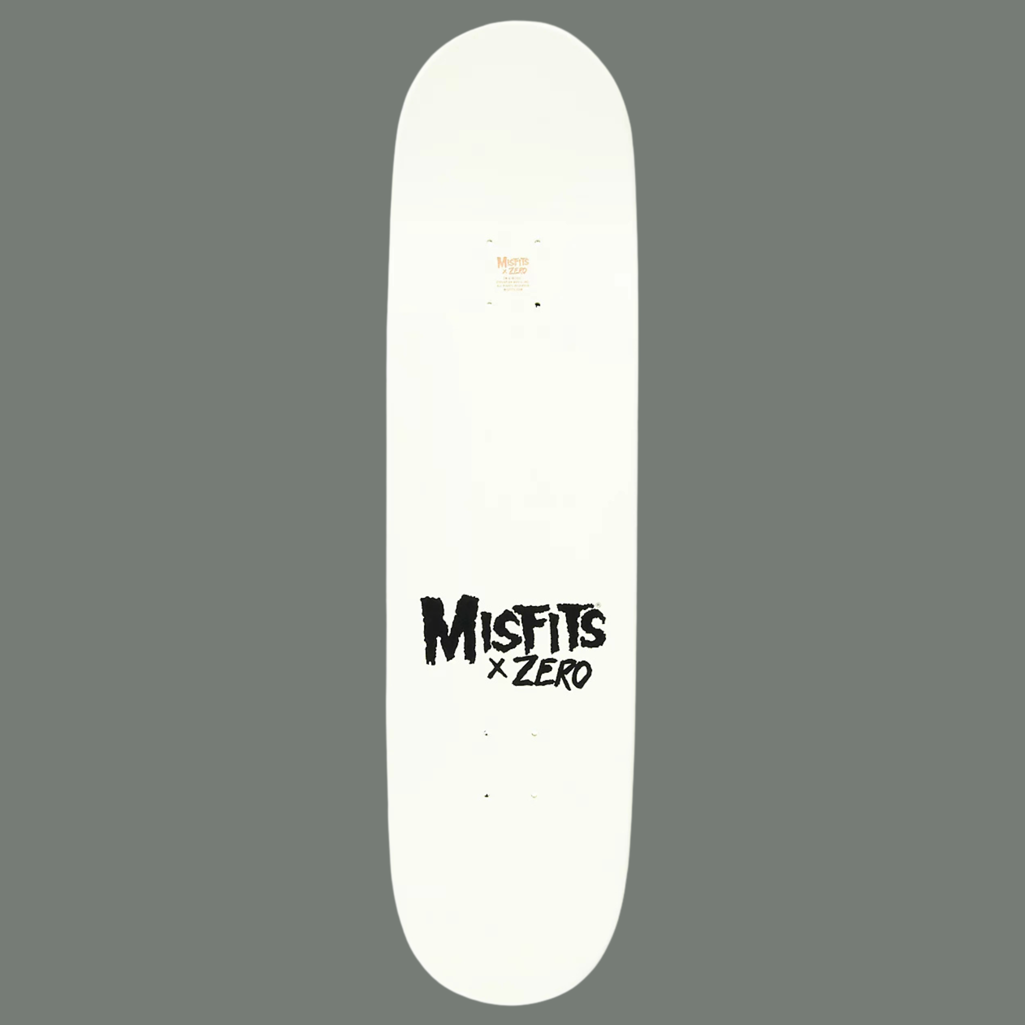 White skateboard deck with 'Misfits x Zero' logo on a gray background