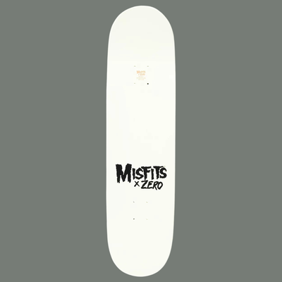 White skateboard deck with 'Misfits x Zero' logo on a gray background
