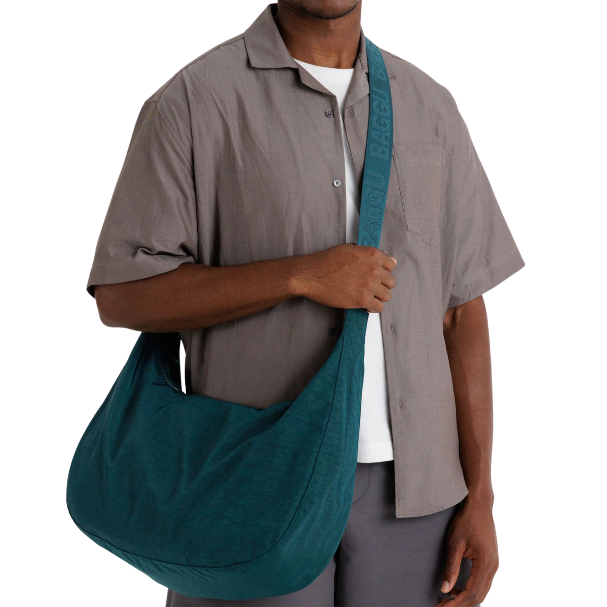 Person holding a teal bag against a white background