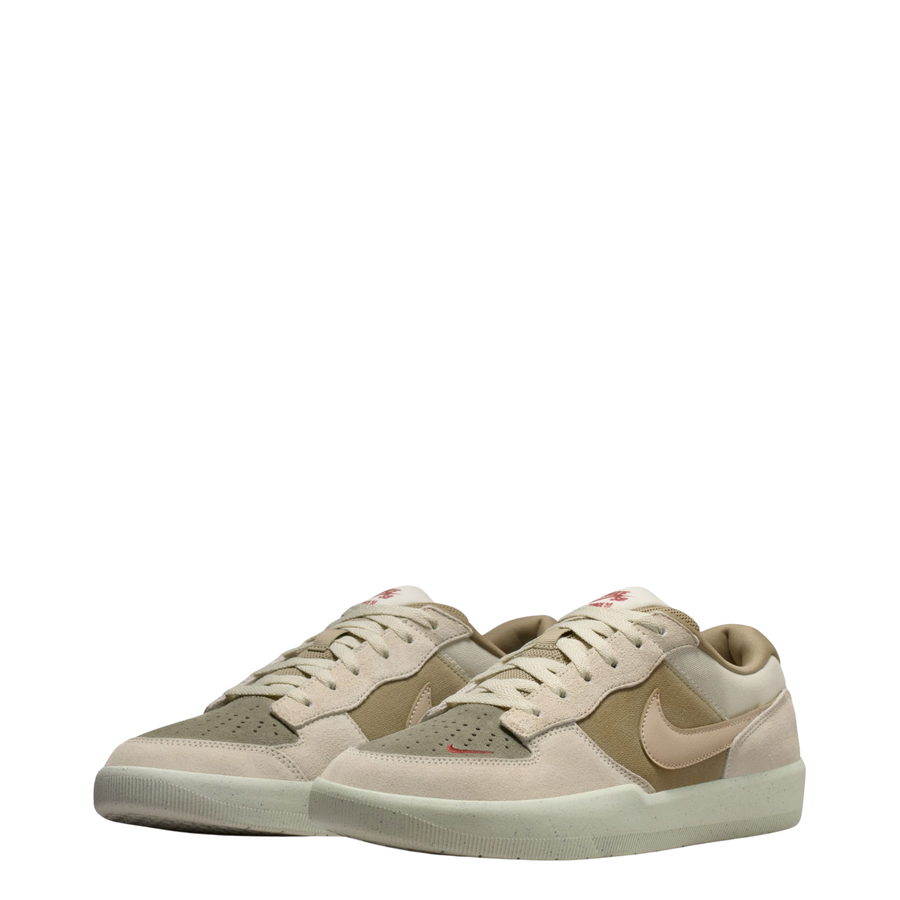 Beige nike sb force 58 sneaker with a brown accent on a white background