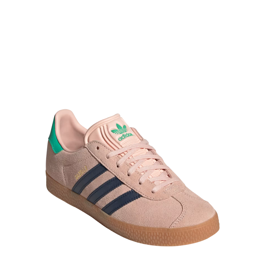 Pink Adidas Kids Juniors gazelle sneaker with green accents and three dark blue stripes on a white background
