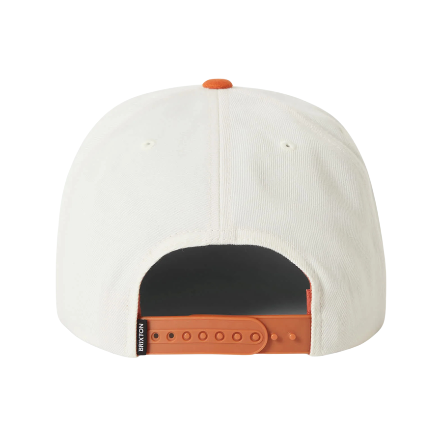 white brixton oath iii snapback hat with orange bill and orange brixton supply logo on a white background