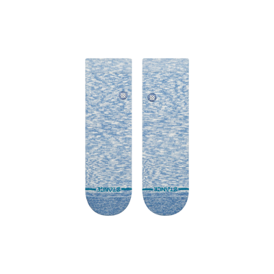 Pair of blue stance slub quarter socks with a subtle pattern on a white background