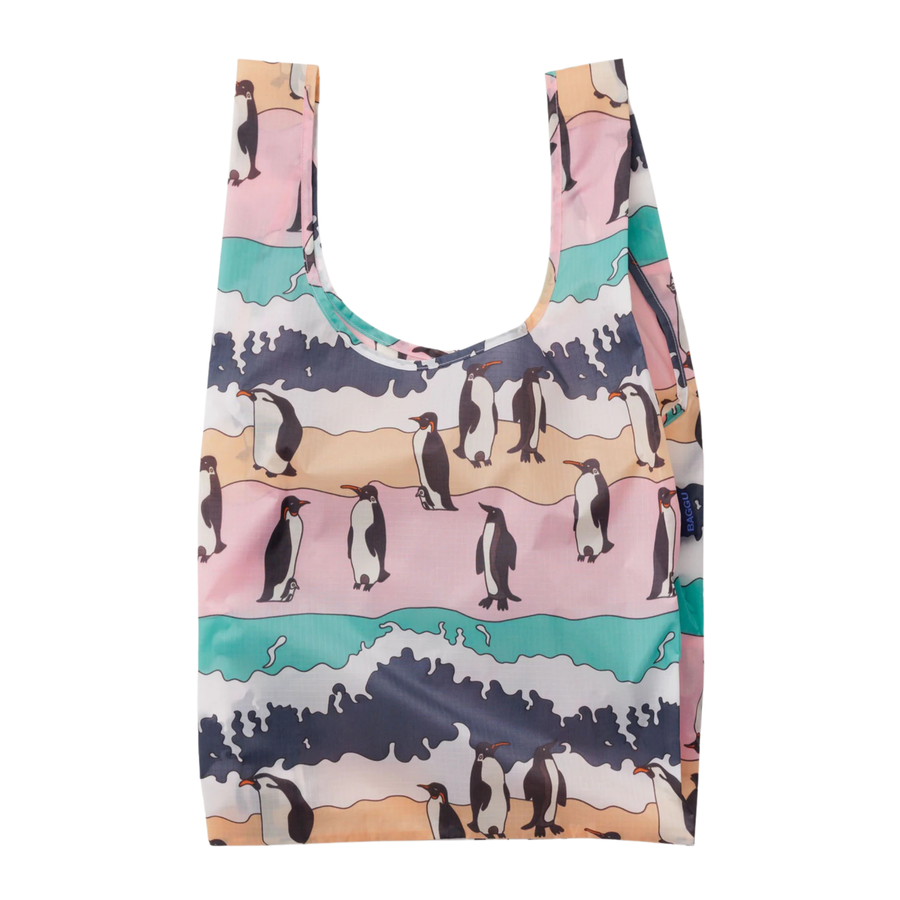 Reusable baggu bag with penguin design on a white background
