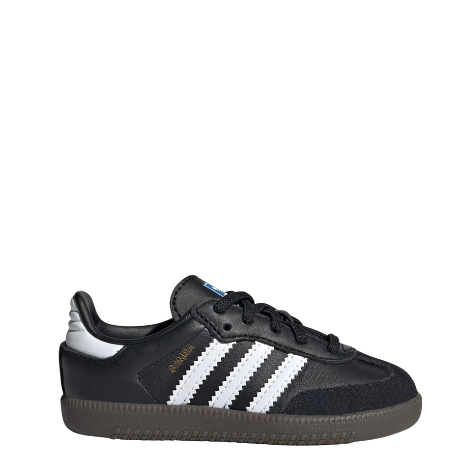 A single Adidas Samba kids sneaker in black leather with signature white side stripes, a gold 'SAMBA' text on the side, and a dark brown gum sole, shown against a plain white background.