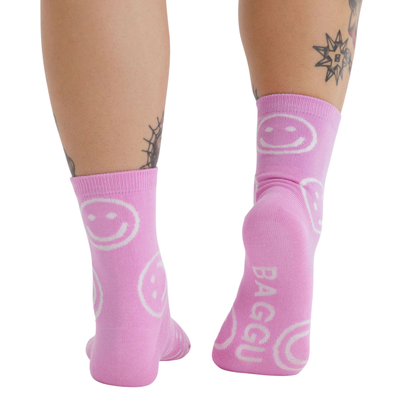 pink baggu crew socks with white smiley faces