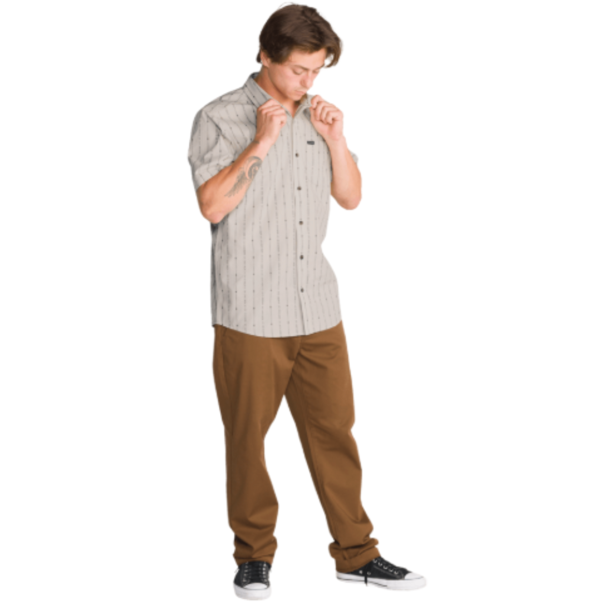 a man wearing an off white volcom bankstone ii short sleeve button-up shirt with vertical pattern with brown pants on a white background
