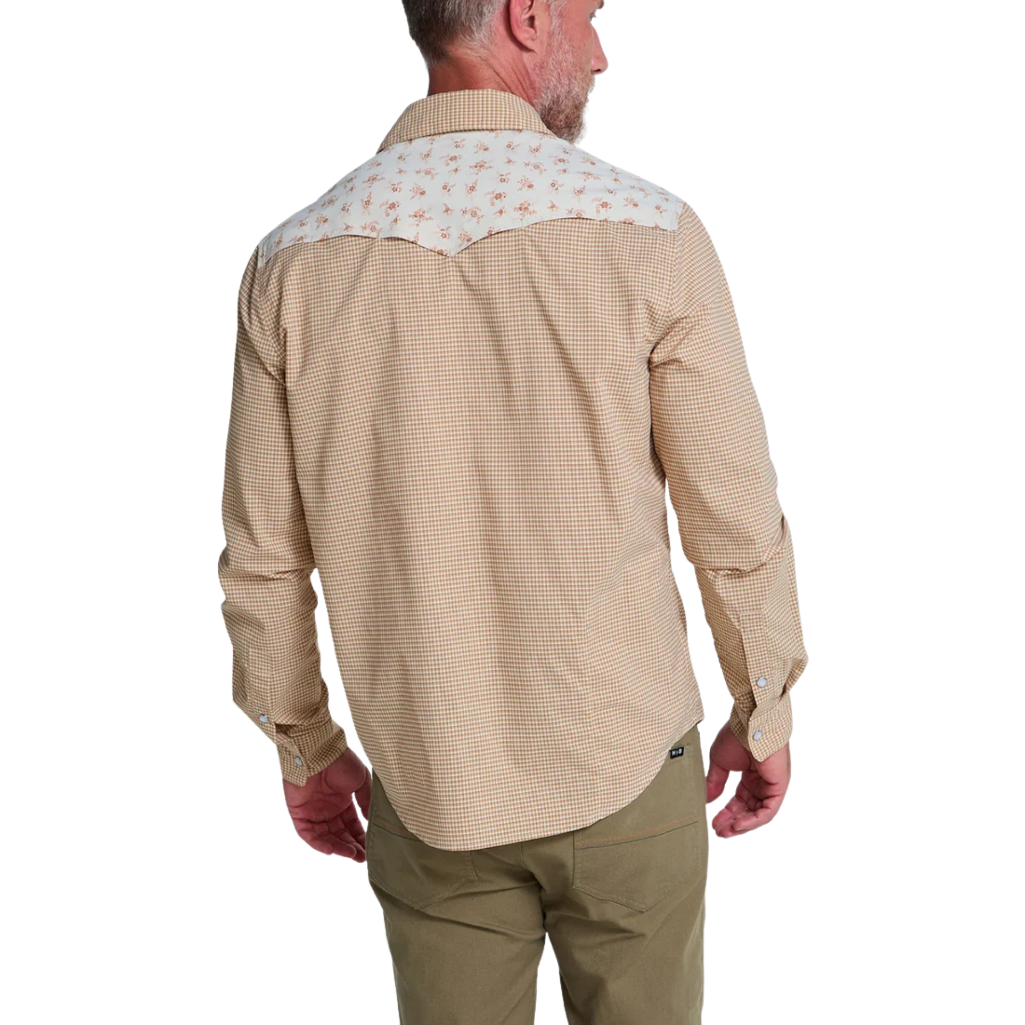 a man from behind wearing A beige and brown checkered long-sleeve howler h bar tech western shirt with beige floral patterned yoke panels on the shoulders, featuring two buttoned chest pockets and a button-down front.