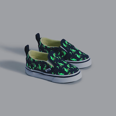 navy vans toddler slip-on with glow-in-the-dark crocodile pattern on a white background