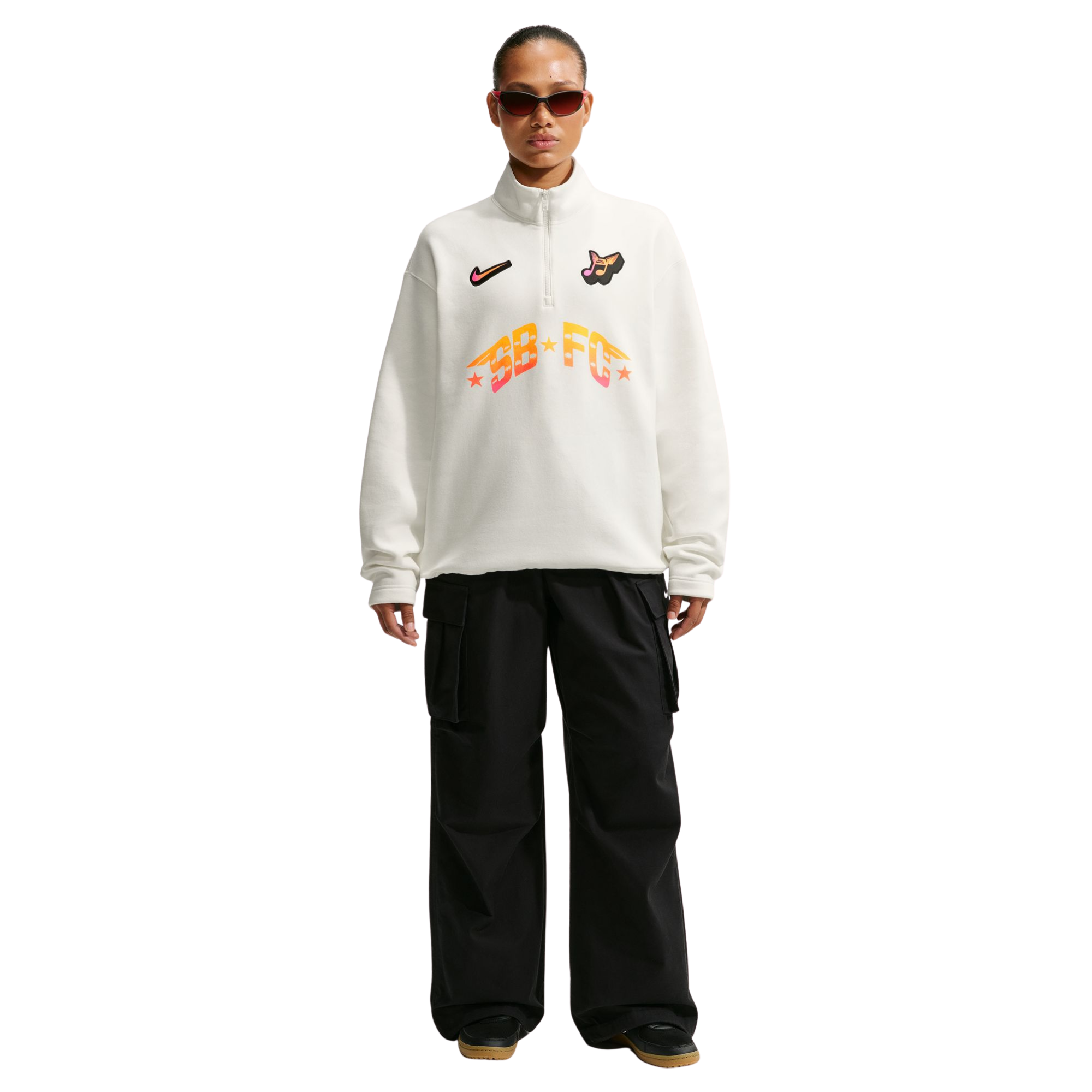 person wearing white half-zip NIKE SB FC PACK sweatshirts with logos and text on a white background