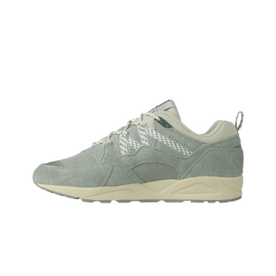 Green karhu legends fusion 2.0 men's sneaker with beige sole on a white background