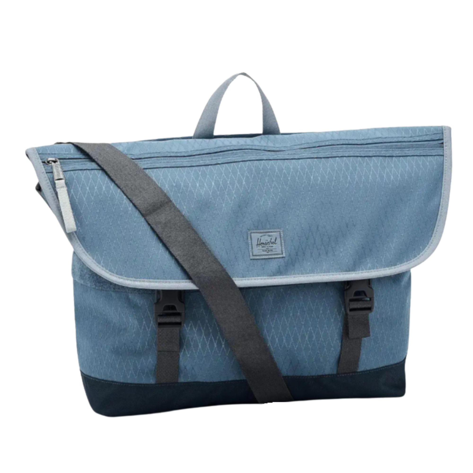 Blue herschel cove messenger bag with a black strap on a white background