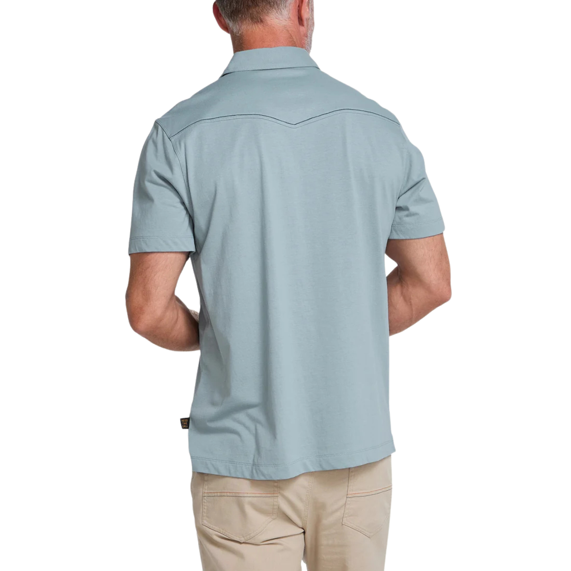 A light blue short-sleeve Howler brothers ranchero polo shirt with western-style stitching, a two-button placket, and a chest pocket, shown flat on a white background.