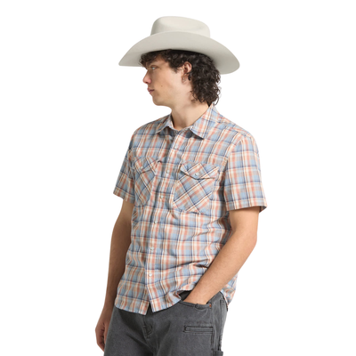 Person wearing a plaid brixton breezy wayne short sleeve shirt and cowboy hat on a white background