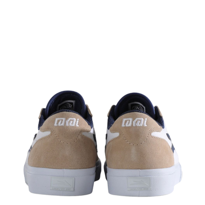 Beige and white lakai manchester skateboard sneaker with a blue logo on a white background