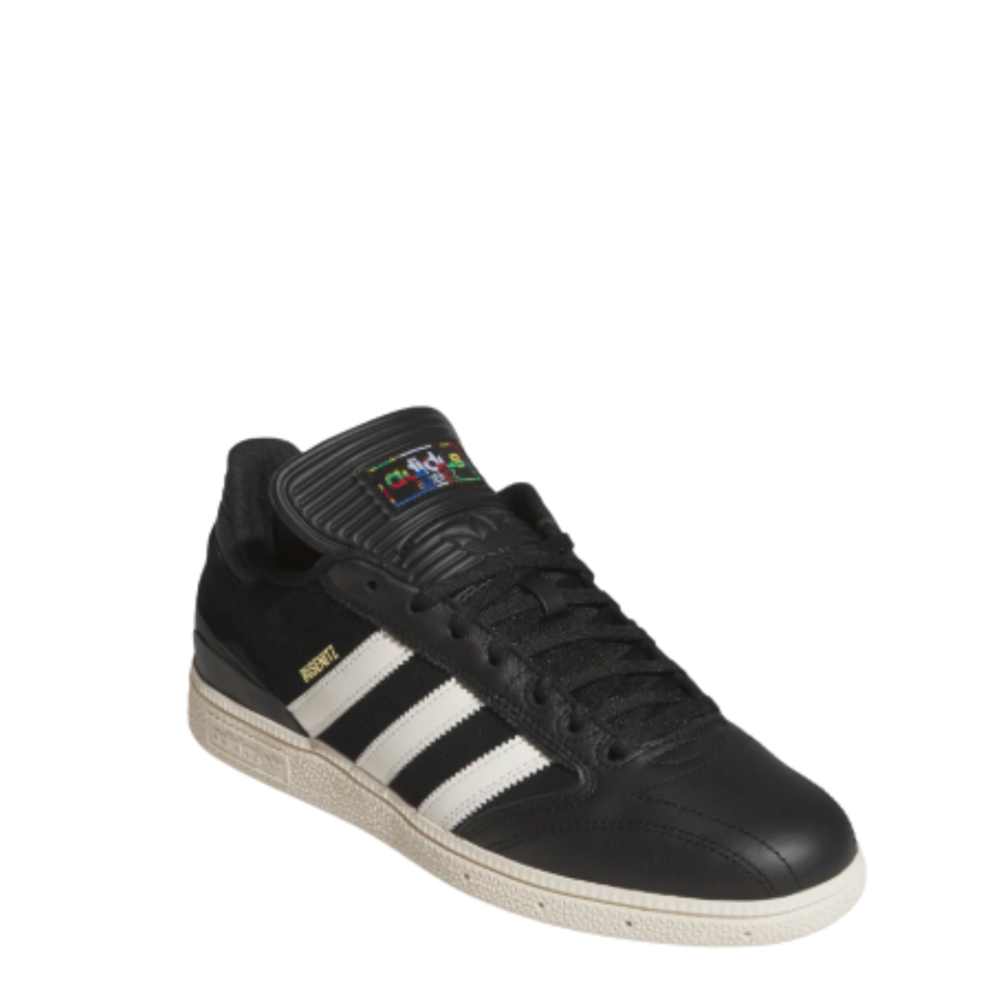 black leather adidas busenitz skateboard sneaker with an off white sole on a white background