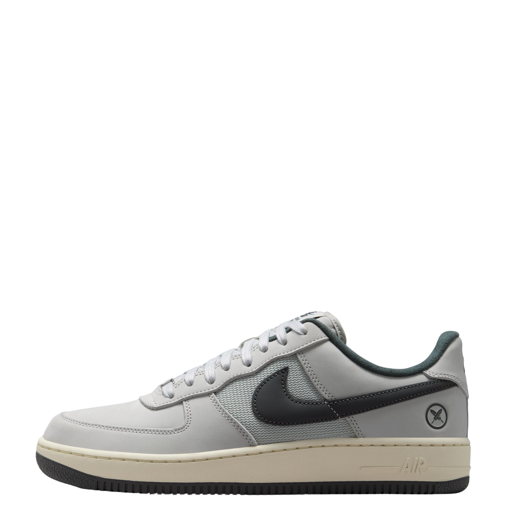 Nike sb x Yuto Air Force 1 Low skateboard sneakers in light gray and dark gray, featuring a light gray leather upper, dark gray Swoosh, and a cream midsole with a black outsole.