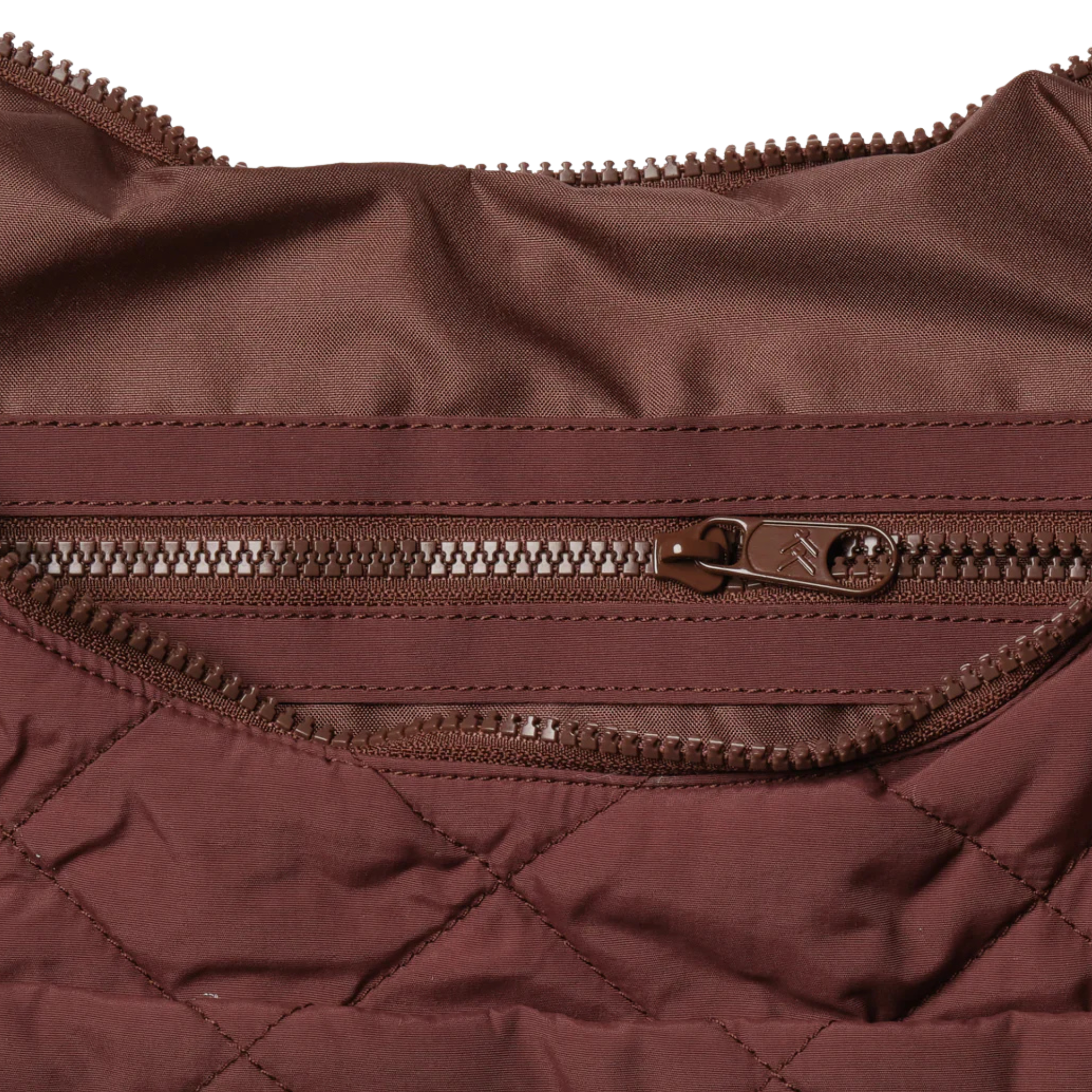 Brown quilted thread slouchy shoulder bag on a white background