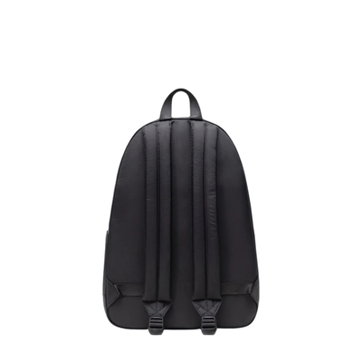 back of a black herschel classic xl backpack on a white background