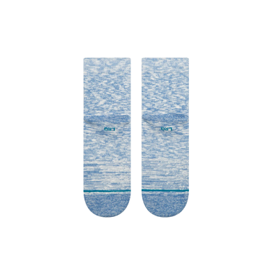 Pair of blue stance slub quarter socks with a subtle pattern on a white background