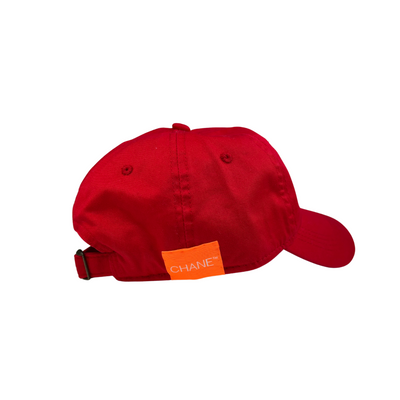 Red cap with orange logo on a white background