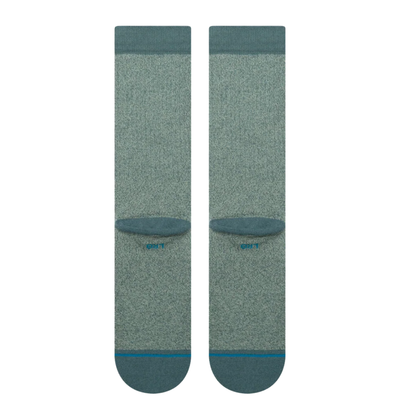 green stance butter blend crew socks on a white background