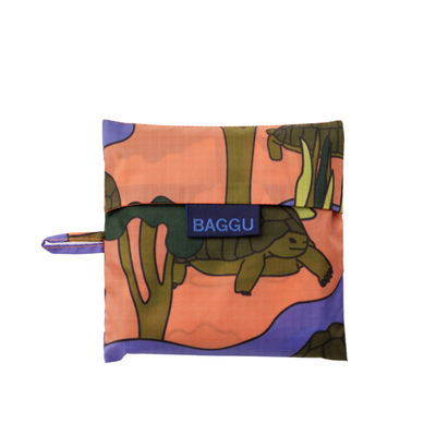 Reusable baggu bag with a colorful turtle pattern on a white background