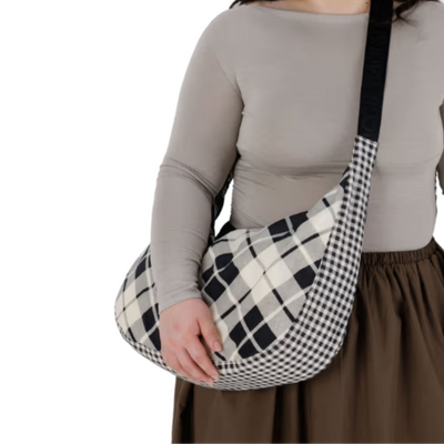 Plaid patterned baggu large nylon crescent handbag with black strap on a white background