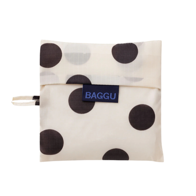 cream colored standard baggu reusable tote with black polka dots on a white backgroun
