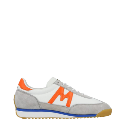 White karhu mestari 76 sneaker with orange 'M' logo on a white background