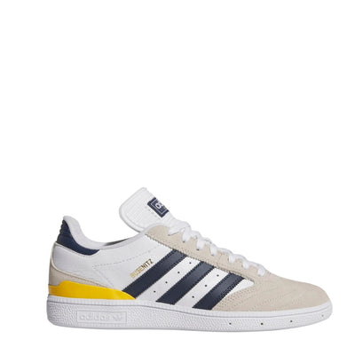 White adidas busenitz pro skateboard sneaker with navy stripes and yellow accent on a white background