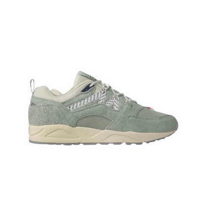 Green karhu legends fusion 2.0 men's sneaker with beige sole on a white background